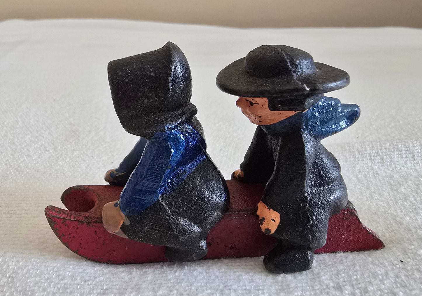 Vintage Cast Iron Amish Boy and Girl on Sled Toy Figurine