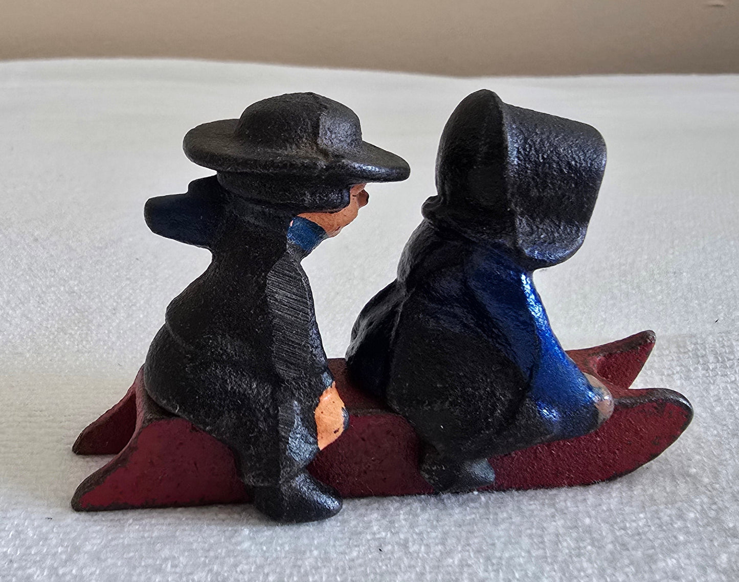 Vintage Cast Iron Amish Boy and Girl on Sled Toy Figurine