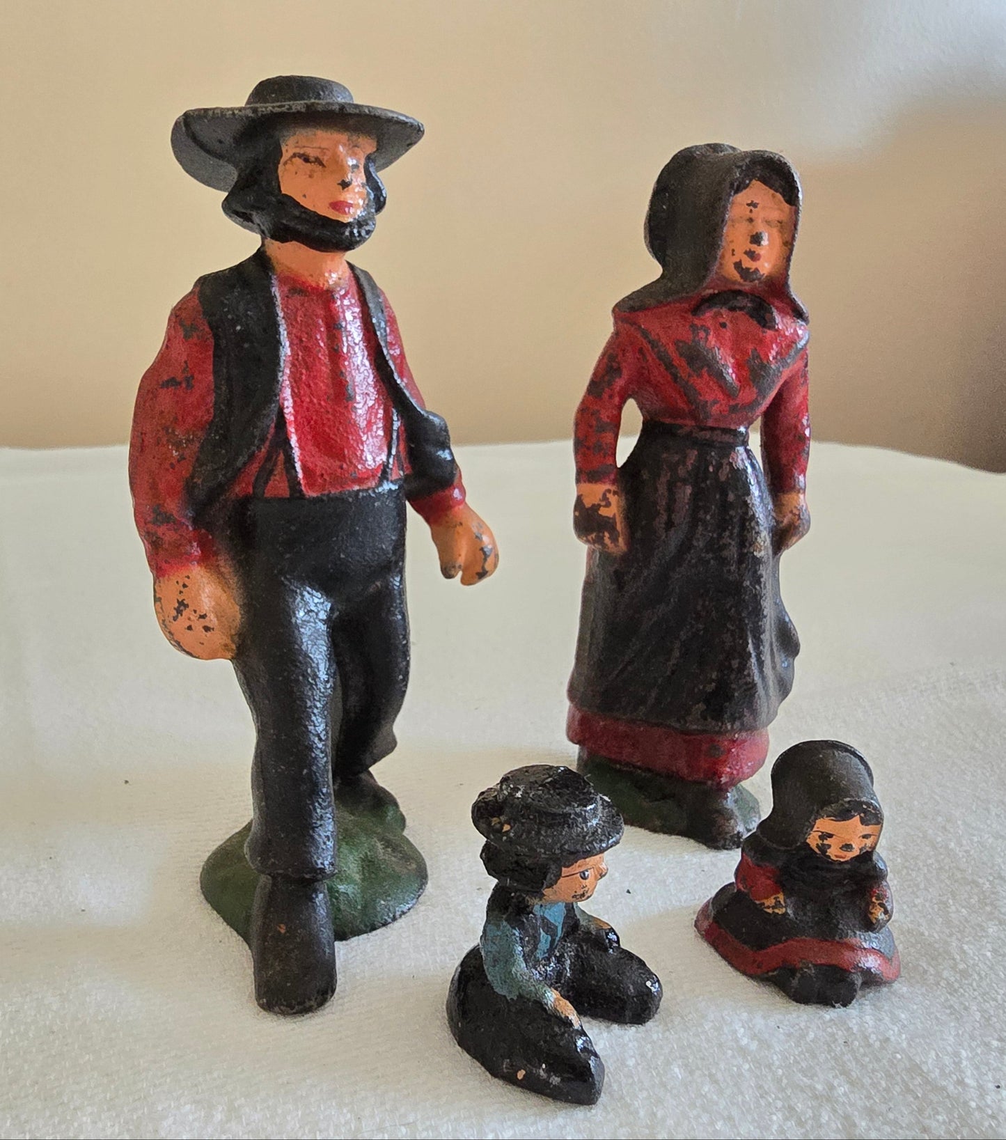 Vintage Cast Iron Amish Family Man and Woman Figurines with Miniature Boy and Girl Children Sitting