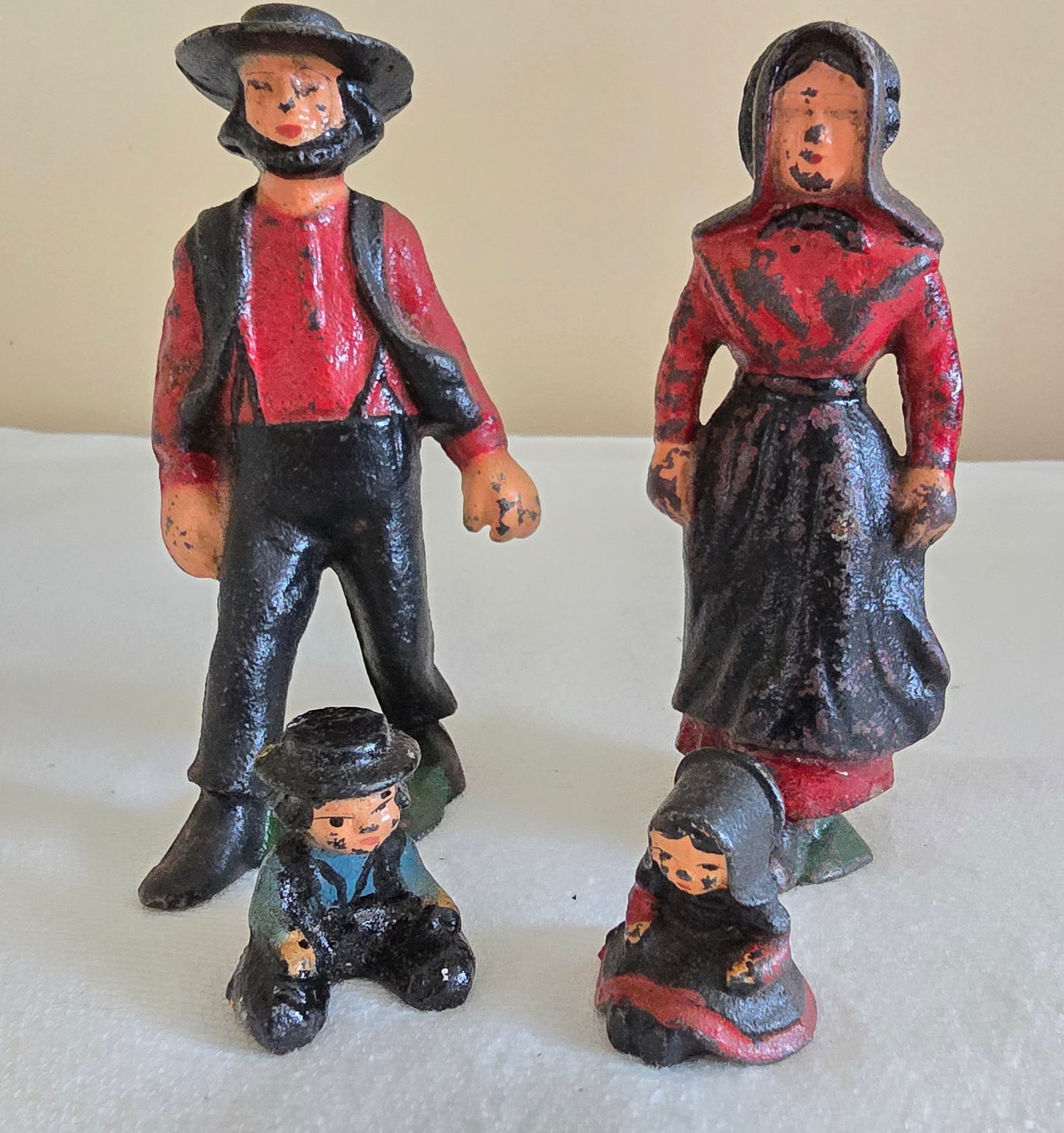 Vintage Cast Iron Amish Family Man and Woman Figurines with Miniature Boy and Girl Children Sitting