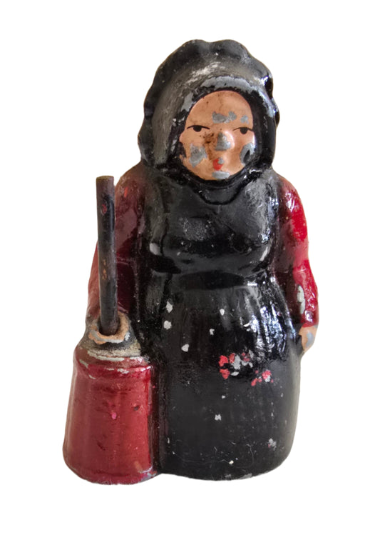 vintage cast iron amish lady with butter churn